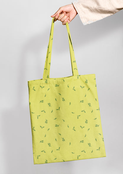 Tote bag mockup featuring the Falling Leaves (Yellow) pattern by Laura Hamzic, Australian surface pattern designer