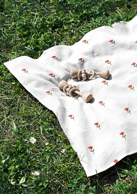 Floral Polka muslin swaddle with delicate dotted watercolour flowers — baby apparel pattern by Australian artist.