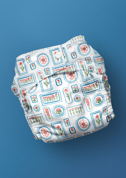 A playful watercolour pattern for baby nappies featuring flowers in frames in red, green and blue by Laura Hamzic Brisbane Surface Pattern Designer