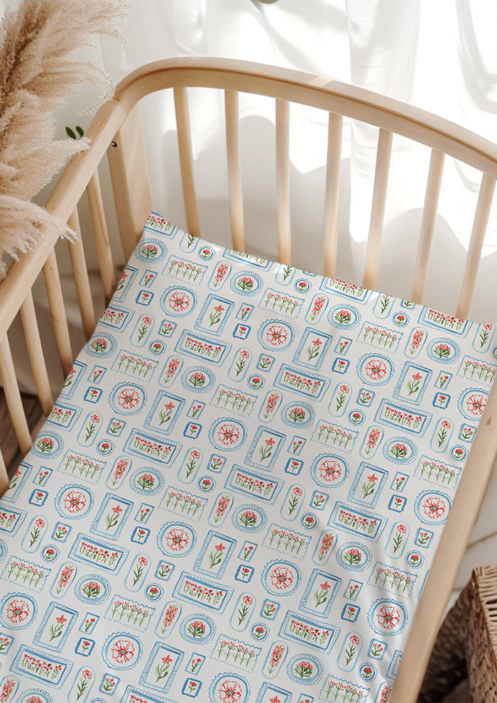 A playful watercolour pattern for cot sheets and baby apparel featuring flowers in frames in red, green and blue by Laura Hamzic Australian Surface Pattern Designer