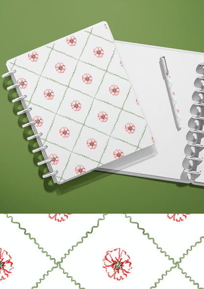 A journal with a watercolour pattern on the cover featuring flowers in a diamond check artwork by Laura Hamzic Brisbane Surface Pattern Designer