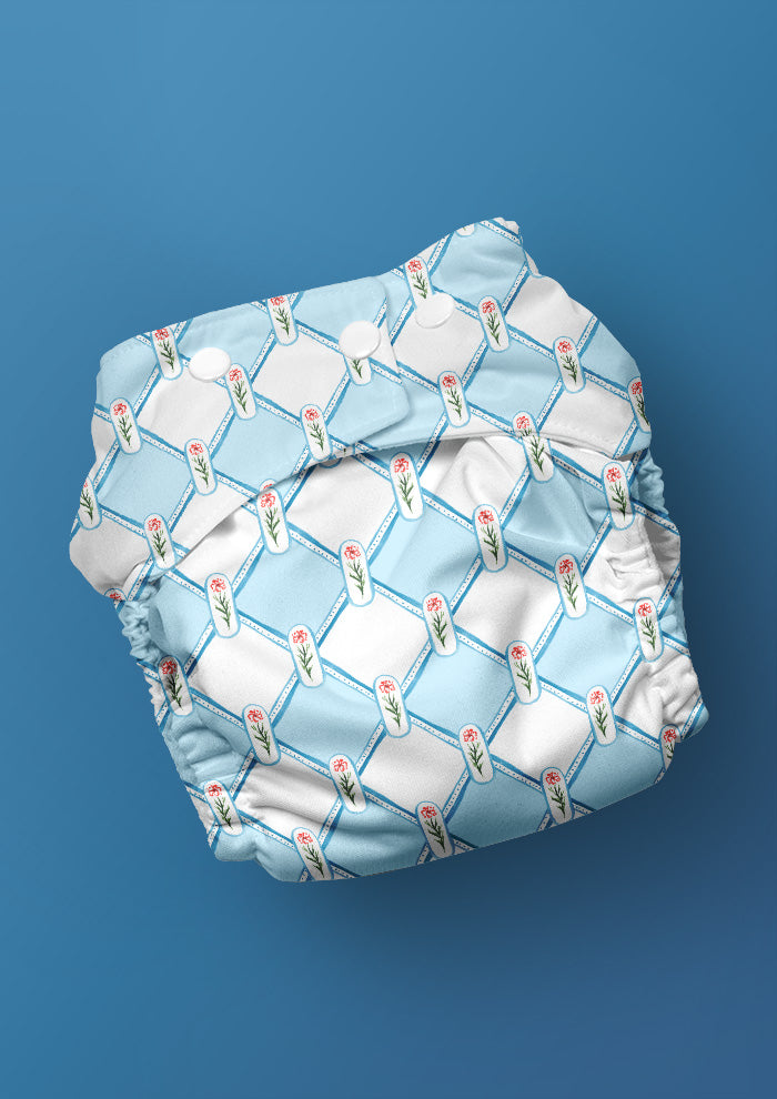 A delicate watercolour pattern for baby nappies featuring flowers in a diamond check by Laura Hamzic Brisbane Surface Pattern Designer