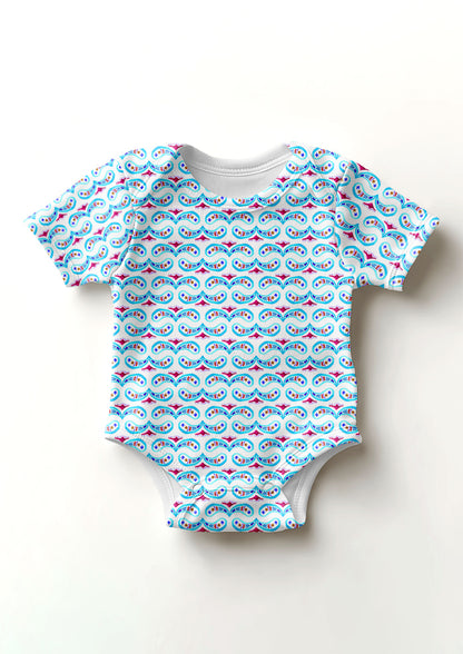 Pink and blue Paisley Whirl pattern on baby onesie mockup. Pattern design by Laura Hamzic, Australian Artist.