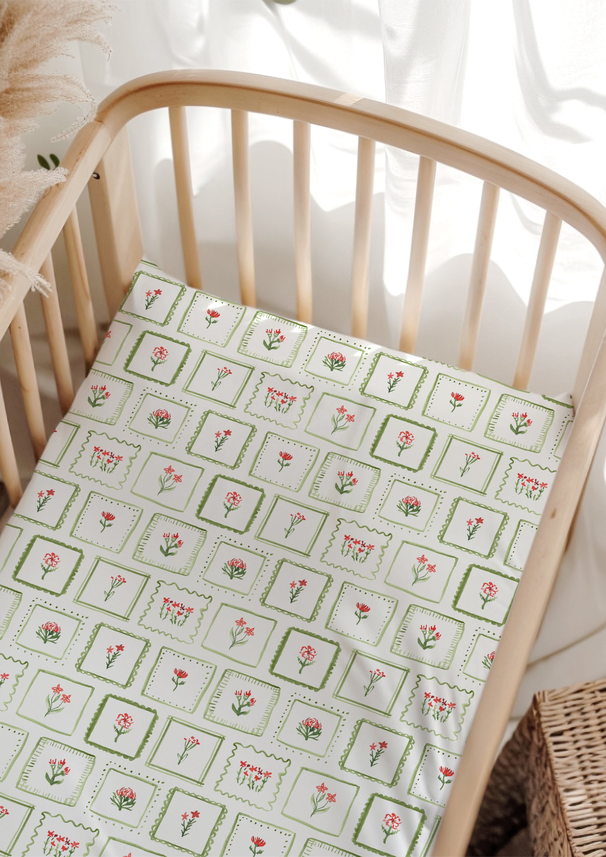 Watercolour botanical cot sheets — Patchwork Garden pattern with playful flowers in frames.
