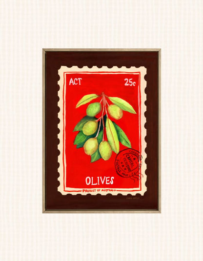 A framed vintage-style art print depicting a branch of green olives on a red background, styled like a retro postage stamp with the word 'OLIVES' and 'ACT 25c' printed on it.