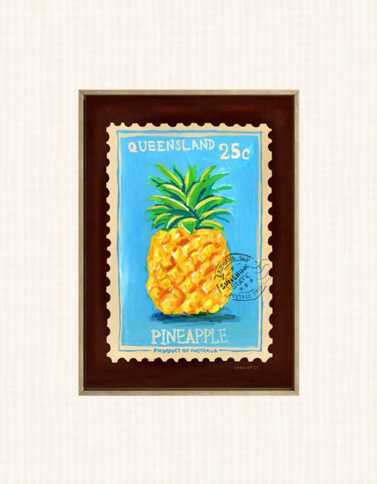 A framed art print depicting a vintage Queensland 25c postage stamp with a pineapple illustration, set against a light cream textured background.