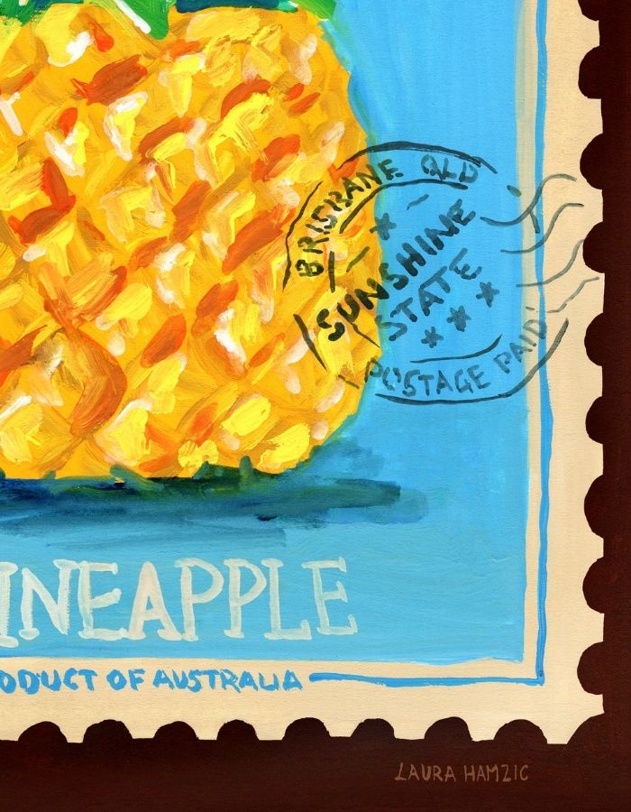 A close-up of a painted postage stamp design featuring a pineapple on a blue background with the words 'PINEAPPLE' and 'PRODUCT OF AUSTRALIA,' plus a circular postmark reading 'Brisbane, QLD Sunshine State Postage Paid.'.