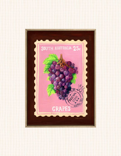 A framed vintage-style South Australia postage stamp illustration featuring a bunch of purple grapes on a pink stamp with a dark brown frame, shown against a light cream textured background.