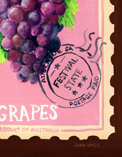 A close-up of a painted artwork featuring a bunch of purple grapes with green leaves on a pink background, with decorative stamp-like markings and the word 'GRAPES' visible. This appears to be the product itself rather than a lifestyle scene, so subject_type is Scenery.