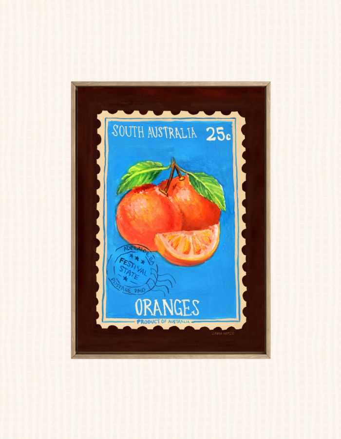 A framed vintage-style South Australia orange illustration print, featuring two oranges and an orange slice on a bright blue background with white text reading 'SOUTH AUSTRALIA 25¢' and 'ORANGES'.
