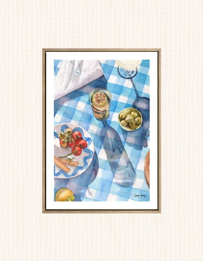 Watercolour art print of a blue and white gingham table setting, greek theme with tomatos, olives and champagne in the sunlight, hand-painted by Laura Hamzic.