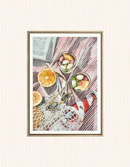 Watercolour art print of a fun beach day - pimms cocktails on a beach blanket and a book, hand-painted by Laura Hamzic.