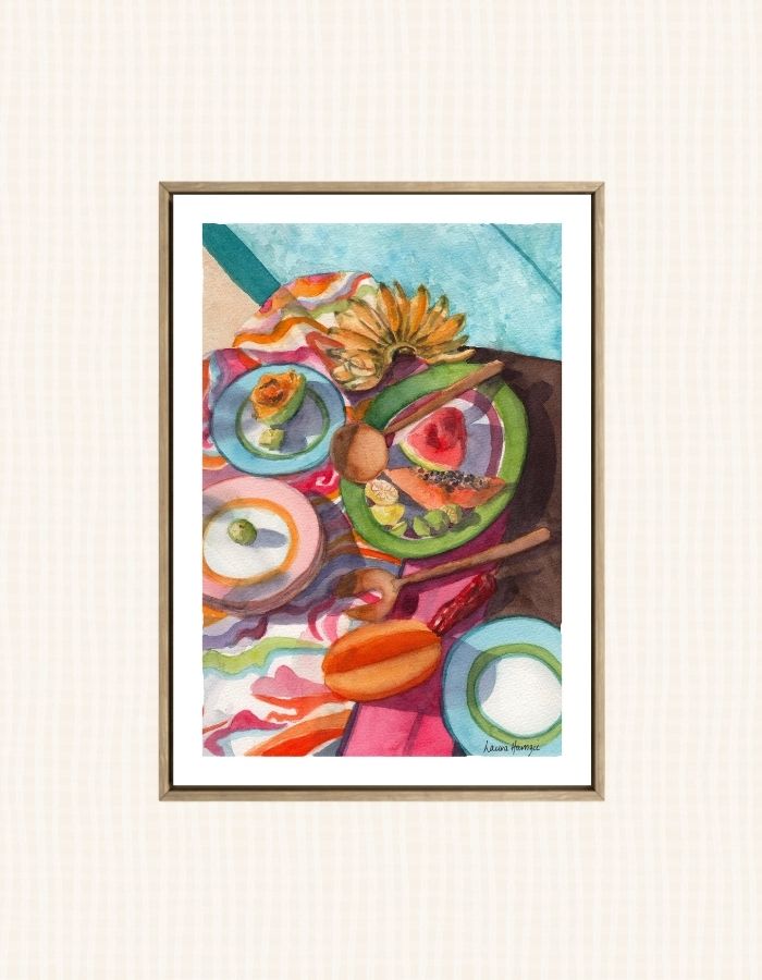 Watercolour art print of a tropical poolside table setting with fruit, fun patterned fabric and bold colours, hand-painted by Laura Hamzic.
