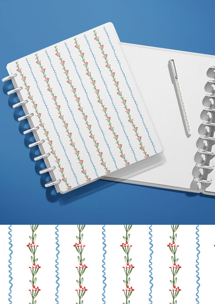 A journal with a watercolour pattern on the cover featuring ribbons and blooms artwork by Laura Hamzic Brisbane Surface Pattern Designer