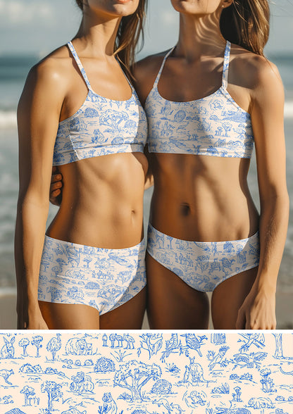 Kids swimwear featuring Australian animal surface pattern – charming fine liner drawings of wombats, kangaroos, emus, and bush creatures. Storybook-style Australiana fabric design.