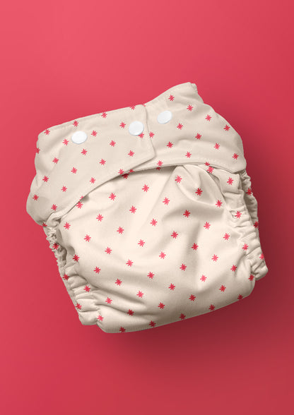 Baby nappy with Star Bright whimsical pencil-drawn stars – inspired by night skies on camping trips, playful Australian kidswear, baby clothing fabric, children’s surface pattern design.