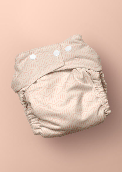 Baby nappy with Zig Zag Track energetic zig-zag surface pattern – coloured pencil texture, inspired by winding bushwalks and childhood discovery, playful Australian kidswear fabric design.